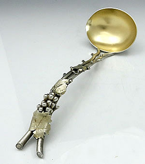 Sterling antique grape motif punch ladle with partially gold washed bowl and leaves
